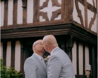 Two Grooms kissing