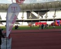 Anna holding the Hog Roast Sign at Olympic Stadium