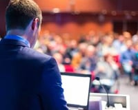 bigstock-Speaker-at-Business-Conference-64962394