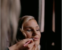 Bride having makeup applied during Bridal Preparations