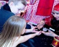 Amelie Appleby reads children's palms at Hamleys