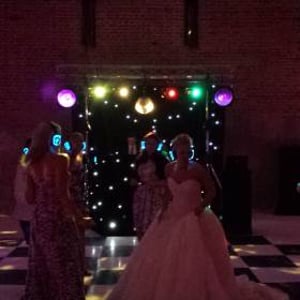 Black Gold Rig with mirrorball, Starcloth backdrop and uplighters (night time)