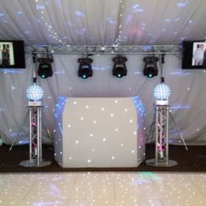 Large white hi-tech rig with TVs