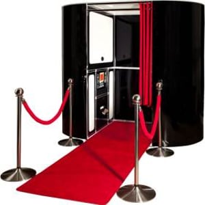 black photobooth with red carpet