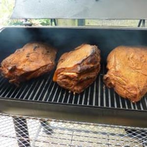 Smoking our pork shoulder the authentic way - 10 hours over oak - makes perfect pulled pork