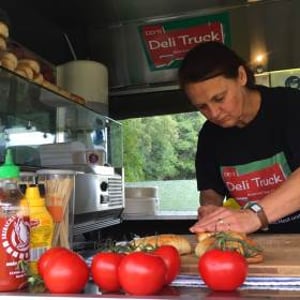 Preparing fresh salads on site in the Deli truck 