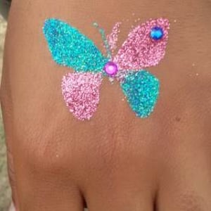 Butterfly glitter tattoo with gems