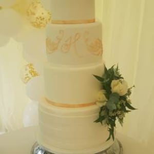 Elegant 4 tier wedding cake by a Cambridge cake designer 