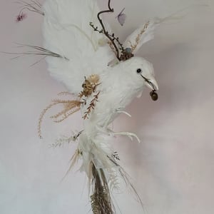 Handmade bird using dried flowers