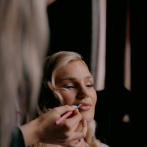 Bride having makeup applied during Bridal Preparations