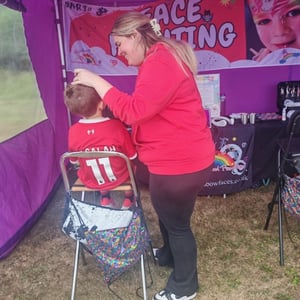 Rainbow Faces Ltd staff in action, face painter