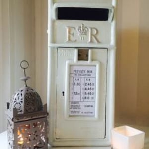 White-Cast-Iron-Post-Box-with-Silver-Writing-£30-to-hire