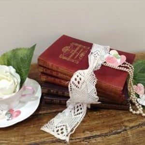 books pearls cup saucer confetti