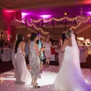 Twilight package @ Gisborough Hall, Starlit white Led dance floor, pink & purple uplighting and our giant illuminated Mr & Mrs.