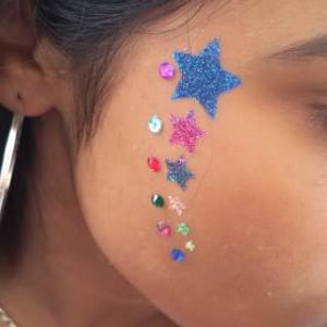 Stars glitter tattoo with gems