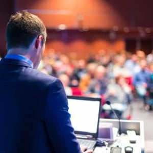 bigstock-Speaker-at-Business-Conference-64962394