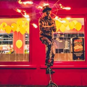 Fire-Umbrella-Unicyclist--at-Pepes-Piri-Piri-Paisley