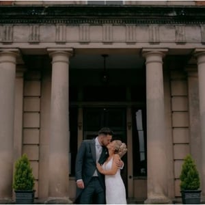Bride and Groom kissing outdoors
