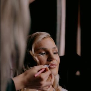 Bride having makeup applied during Bridal Preparations