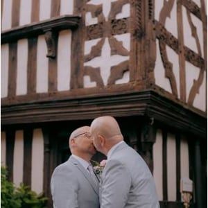 Two Grooms kissing