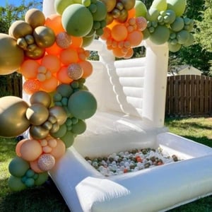 white bounchy castle cheeky events