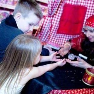 Amelie Appleby reads children's palms at Hamleys