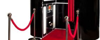 black photobooth with red carpet