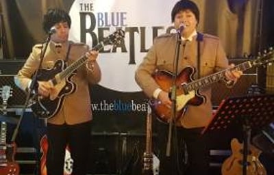 The Blue Beatles Duo performing in Nehru jackets suits