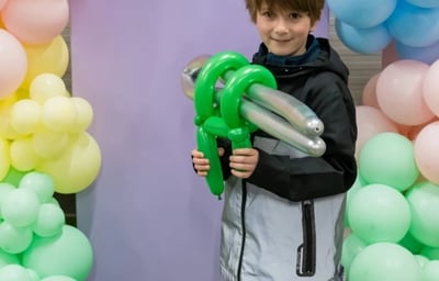 Rainbow Faces Ltd 2024 balloon modellign for an Easter event