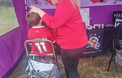 Rainbow Faces Ltd staff in action, face painter