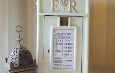 White-Cast-Iron-Post-Box-with-Silver-Writing-£30-to-hire