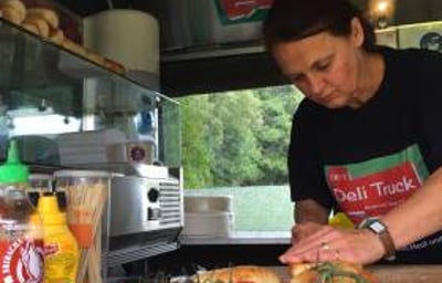 Preparing fresh salads on site in the Deli truck