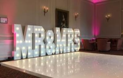 The stunning Crathorne Hall Hotel with one of our gloss white Led Starlit dance floors and our giant Led Mr & Mrs with blush pink uplighting.