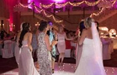 Twilight package @ Gisborough Hall, Starlit white Led dance floor, pink & purple uplighting and our giant illuminated Mr & Mrs.