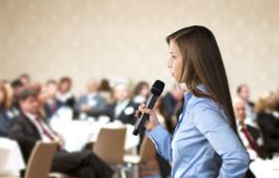 graphicstock-beautiful-business-woman-is-speaking-on-conference_BR74d1sbb