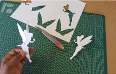 Tinkerbell place names / cake tops. 