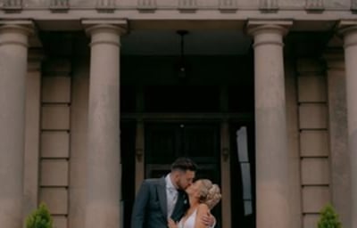 Bride and Groom kissing outdoors