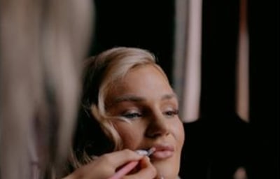Bride having makeup applied during Bridal Preparations