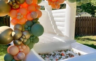 white bounchy castle cheeky events