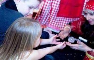 Amelie Appleby reads children's palms at Hamleys