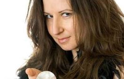 Amelie Appleby mingles amongst guests with her crystal ball