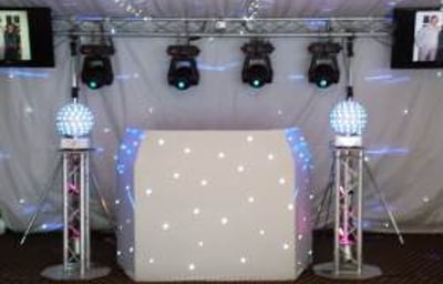 Large white hi-tech rig with TVs