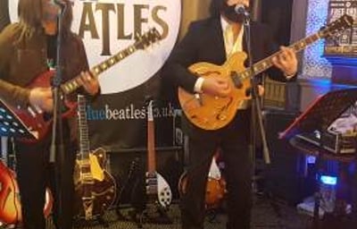 The Blue Beatles Duo performing in late era costumes