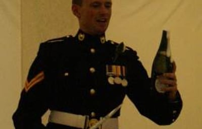 The Groom Opens His Champagne by 'Sabrage'