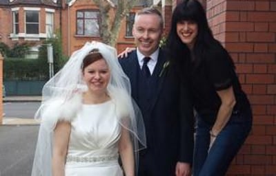 A photo with the bride and groom after the service
