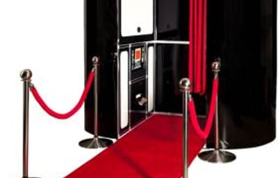 black photobooth with red carpet