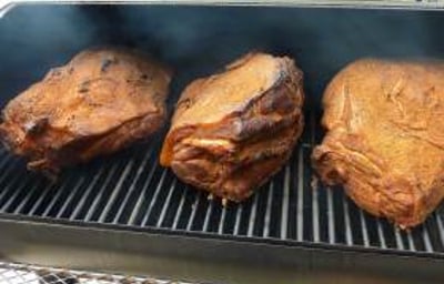 Smoking our pork shoulder the authentic way - 10 hours over oak - makes perfect pulled pork