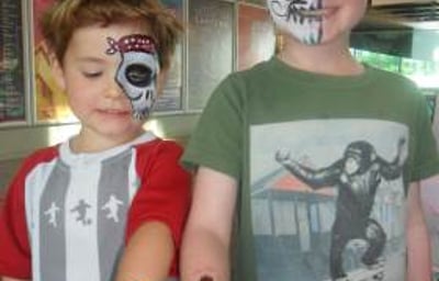 Face paint + glitter tattoos = happy boys!