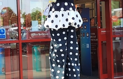 Stiltwalker Candy Clown refreshing the Matalan store Glenrothes.jpg
