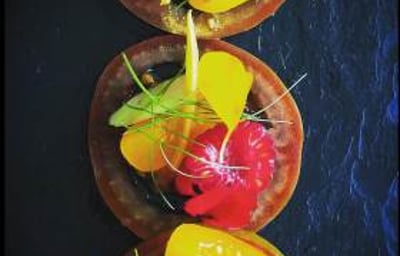 Tomatoes and edible flowers from the kitchen garden. Canapé 